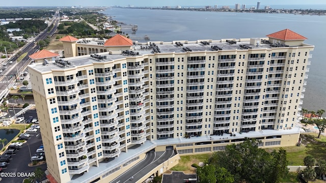 birds eye view of property with a city view and a water view
