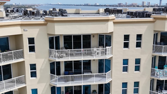 view of property with a city view and a water view