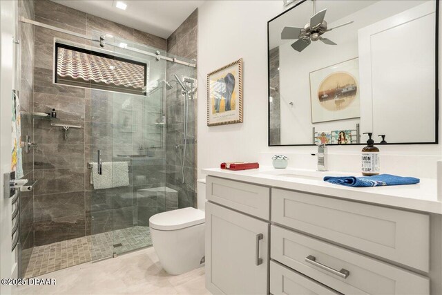 634 Woodbridge Dr, Ormond Beach, FL 32174 - full bath featuring vanity, toilet, a shower stall, ceiling fan, and tile patterned floors