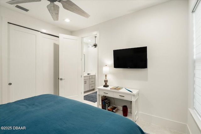 634 Woodbridge Dr, Ormond Beach, FL 32174 - bedroom featuring baseboards, tile patterned floors, recessed lighting, ceiling fan, and a closet