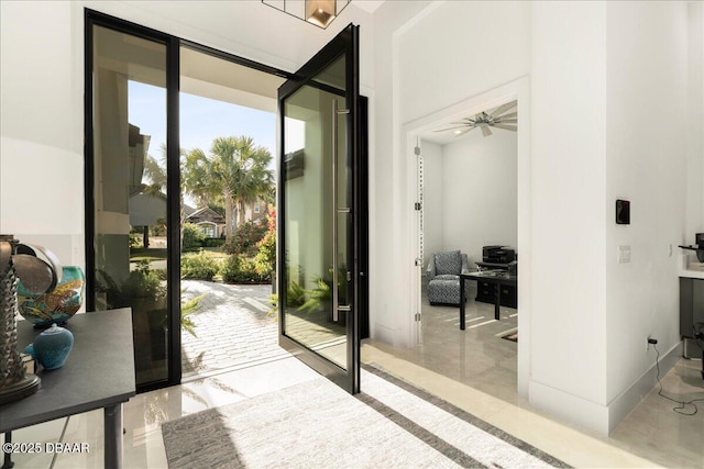 634 Woodbridge Dr, Ormond Beach, FL 32174 - entryway featuring a ceiling fan and marble finish flooring