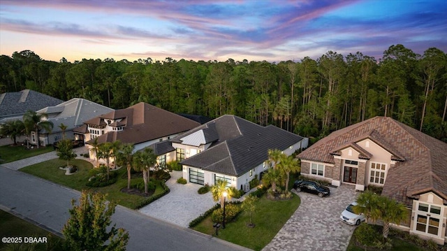 634 Woodbridge Dr, Ormond Beach, FL 32174 - aerial view at dusk of a forest view