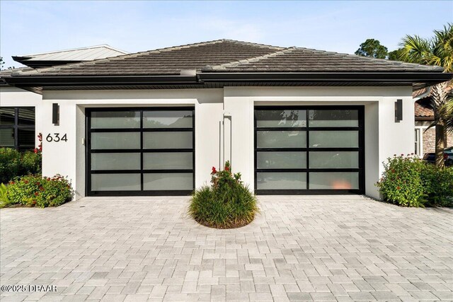 634 Woodbridge Dr, Ormond Beach, FL 32174 - garage with decorative driveway