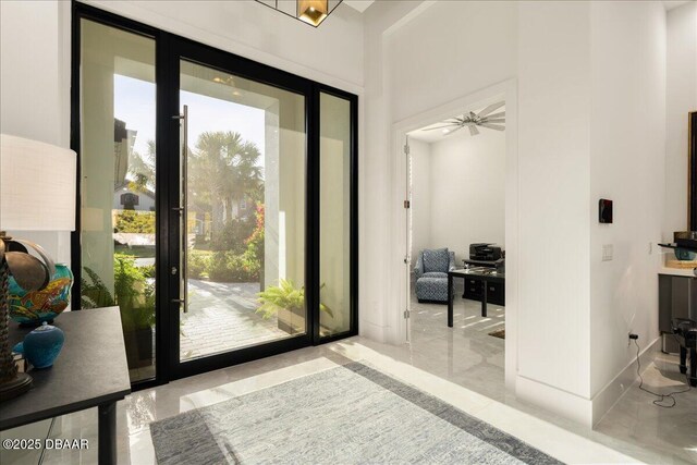 634 Woodbridge Dr, Ormond Beach, FL 32174 - doorway to outside with a ceiling fan and marble tiled floors