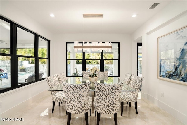 634 Woodbridge Dr, Ormond Beach, FL 32174 - dining room with recessed lighting and baseboards