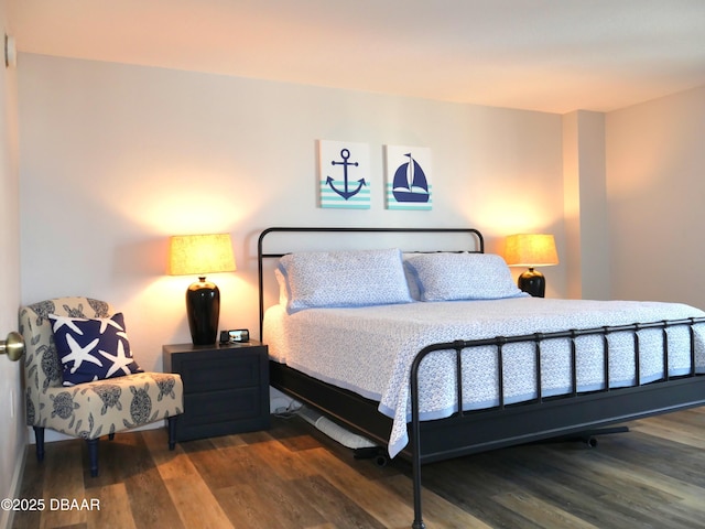 bedroom featuring wood finished floors