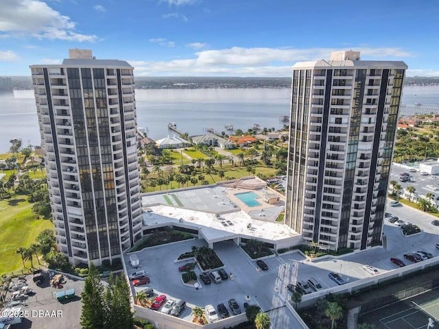 birds eye view of property with a water view