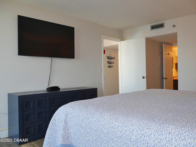 bedroom with visible vents
