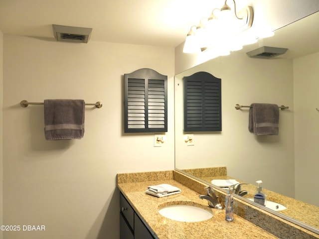 bathroom with visible vents and vanity