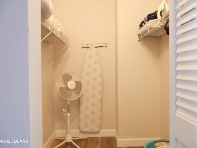 spacious closet with wood finished floors