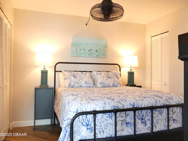 bedroom with baseboards and wood finished floors