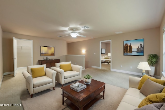 living room with light carpet and ceiling fan