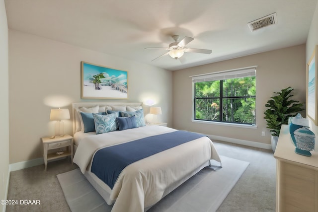 carpeted bedroom featuring ceiling fan