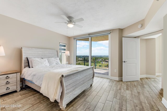 3797 S Atlantic Ave Unit 404, Daytona Beach, FL 32118 - bedroom featuring light wood finished floors, access to outside, baseboards, and a ceiling fan