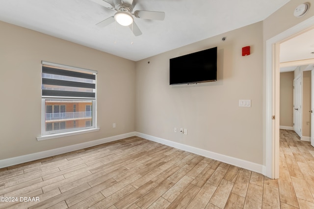 unfurnished room with light hardwood / wood-style floors and ceiling fan