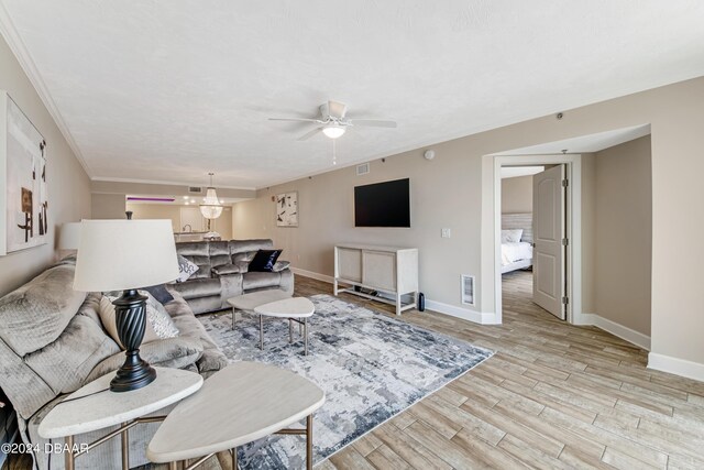 3797 S Atlantic Ave Unit 404, Daytona Beach, FL 32118 - living room with light wood finished floors, baseboards, and ceiling fan