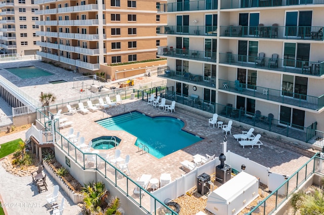 3797 S Atlantic Ave Unit 404, Daytona Beach, FL 32118 - community pool with a hot tub and a patio