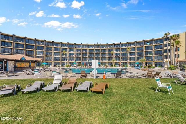 view of swimming pool with a patio area, a lawn, and a gazebo