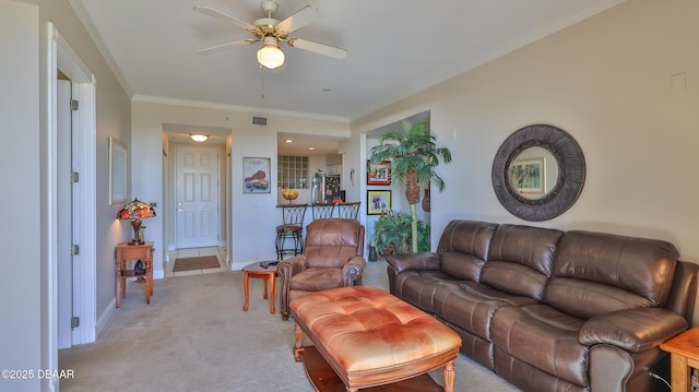 carpeted living room with ornamental molding and ceiling fan