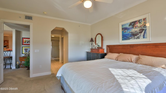 carpeted bedroom with ceiling fan and ornamental molding