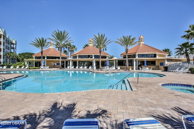 view of pool with a gazebo, a patio, and a hot tub