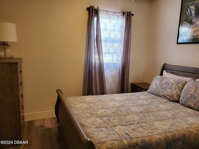 bedroom featuring hardwood / wood-style floors