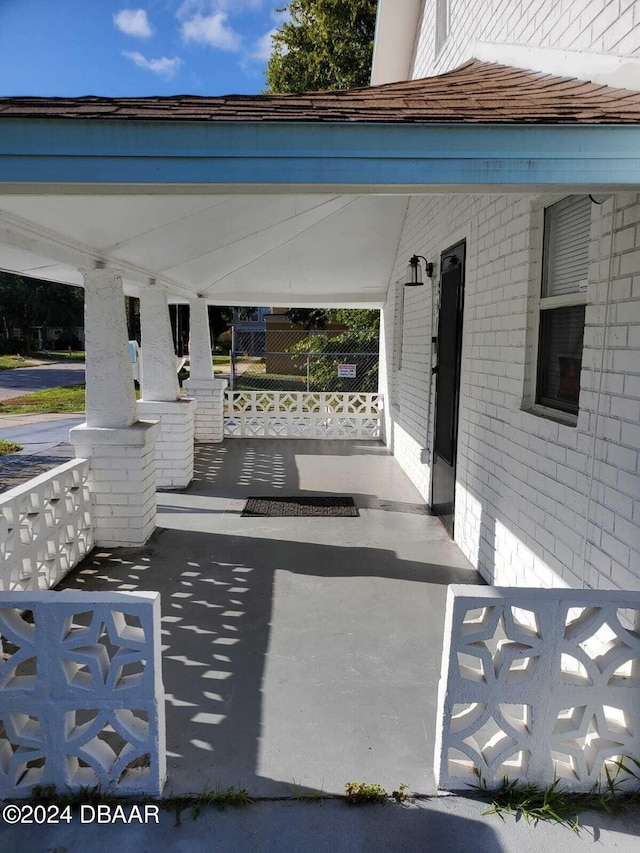 view of patio featuring a porch