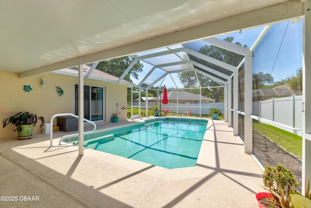 view of swimming pool featuring a patio area, a fenced backyard, glass enclosure, and a fenced in pool