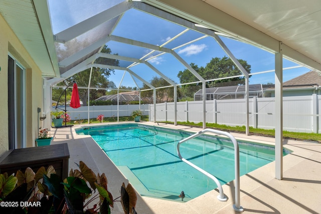 view of swimming pool featuring a patio, a fenced backyard, and a fenced in pool