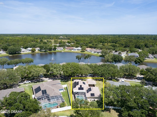 birds eye view of property with a water view and a forest view