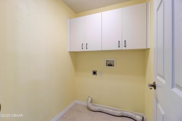 washroom with light tile patterned floors, hookup for a washing machine, cabinet space, electric dryer hookup, and baseboards