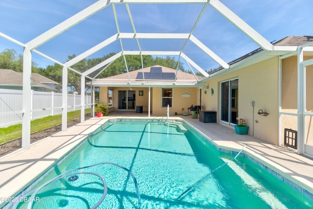 view of pool with a lanai, fence private yard, a patio area, and a fenced in pool