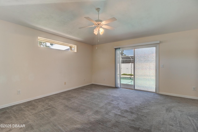 unfurnished room with carpet, a ceiling fan, and baseboards