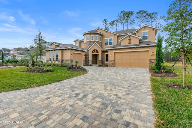 view of front facade featuring stone siding, stucco siding, decorative driveway, and a front lawn