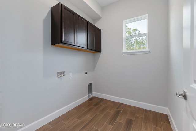 clothes washing area featuring washer hookup, cabinets, and hookup for an electric dryer