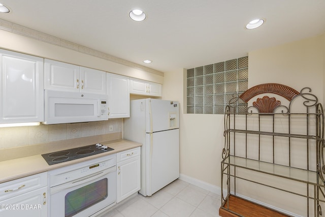 4624 Harbour Village Blvd Unit 4204, Ponce Inlet, FL 32127 - kitchen with white cabinets, white appliances, and light countertops