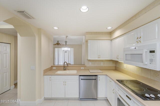 4624 Harbour Village Blvd Unit 4204, Ponce Inlet, FL 32127 - kitchen featuring black electric cooktop, visible vents, stainless steel dishwasher, a sink, and white microwave