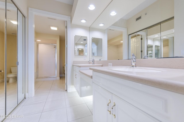 4624 Harbour Village Blvd Unit 4204, Ponce Inlet, FL 32127 - bathroom featuring tile patterned flooring, visible vents, toilet, vanity, and baseboards