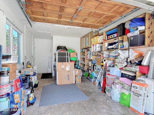 storage room featuring a garage and attic access