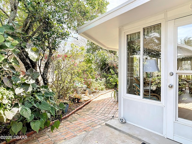 property entrance featuring a patio area