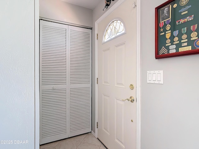 entrance foyer featuring light tile patterned floors