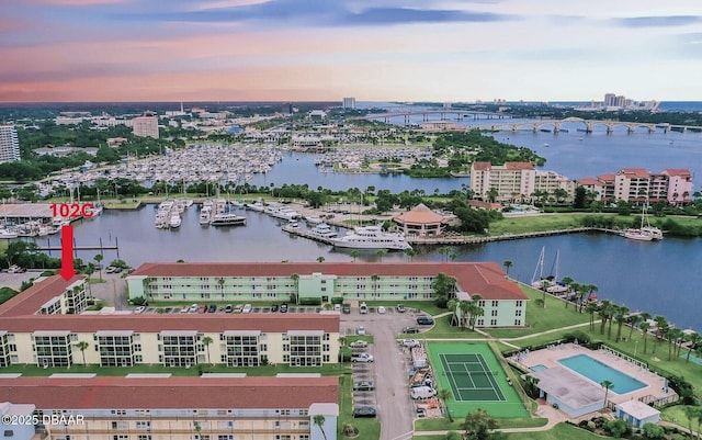 717 S Beach St Unit 102C, Daytona Beach, FL 32114 - aerial view at dusk of a water view, view of marina, a view of apartment building / complex, and a view of city