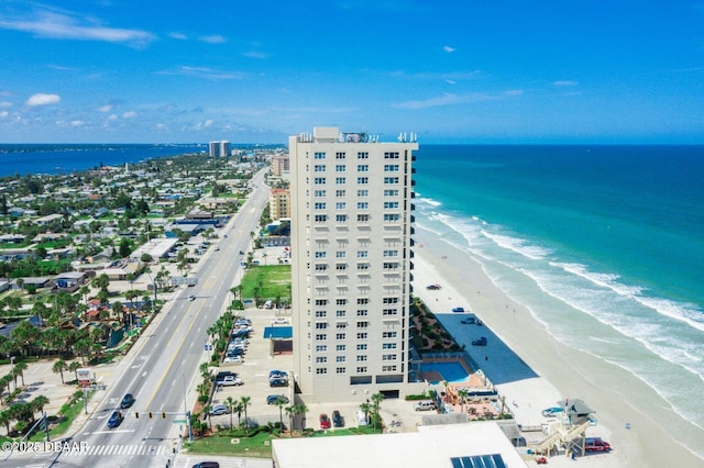 aerial view with a water view, a city view, and a view of the beach