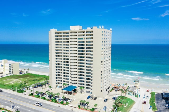 birds eye view of property with a water view, a city view, and a view of the beach