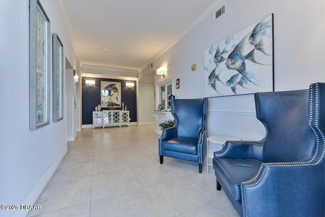 living area featuring ornamental molding, tile patterned flooring, visible vents, and baseboards