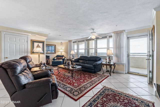 living area featuring ornamental molding, a textured ceiling, baseboards, and light tile patterned floors