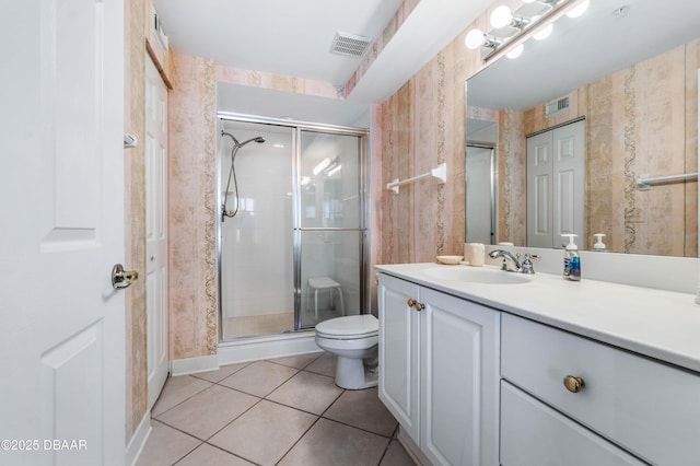 full bathroom featuring visible vents, toilet, tile patterned floors, a shower stall, and a closet