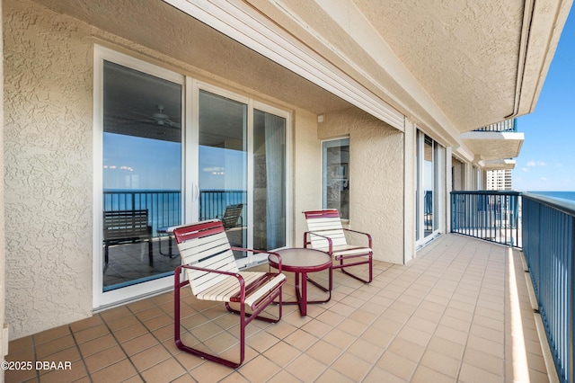 balcony featuring a water view