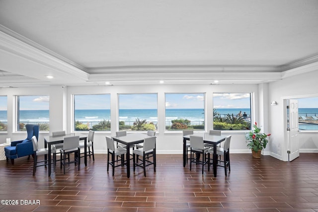 sunroom featuring a water view and plenty of natural light