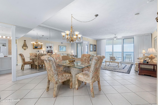 dining room with ceiling fan with notable chandelier, floor to ceiling windows, light tile patterned flooring, and crown molding